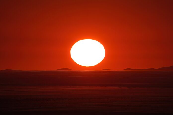 084_Sun_setting_in_the_Namib_desert_Photo_by_Giles_Laurent