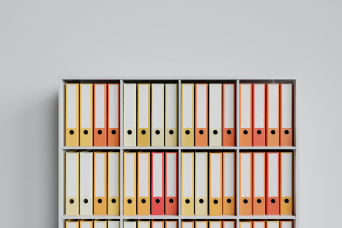 Cluttered shelf with colorful folders as 3d Rendering